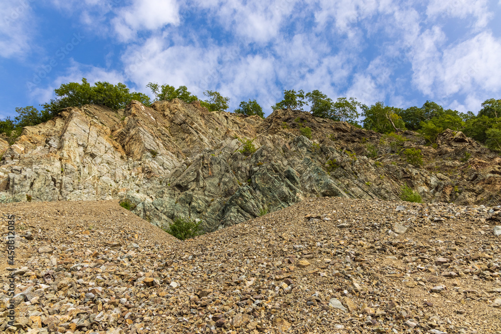 Cliffs of the steep coast of the Pacific Ocean in Kamchatka, interesting geological structures of the cliff. Cliffs of the steep coast of the Pacific Ocean in Kamchatka, interesting geological structures of the cliff.