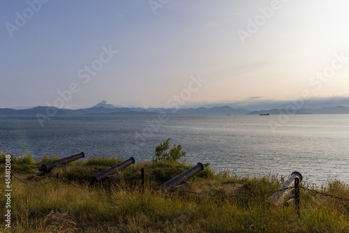 Ancient cannons - coastal artillery on the coast of Kamchatka, the cannons are aimed at the bay and volcanoes.