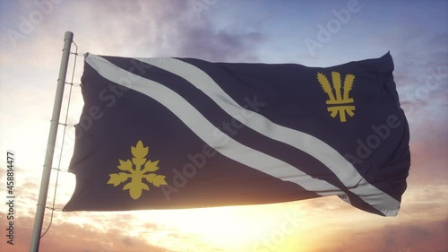 Oxfordshire flag, England, waving in the wind, sky and sun background photo