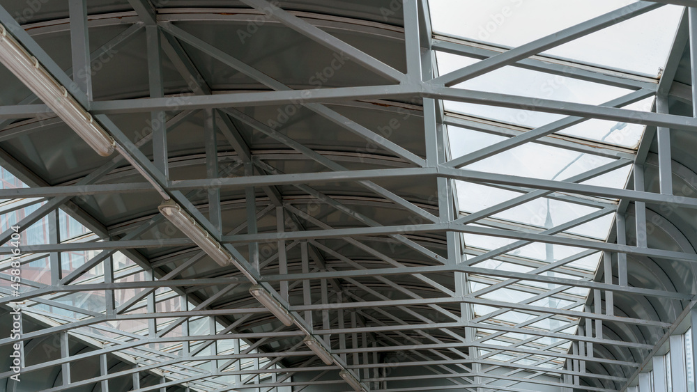 grey metal beams under local administrative building roof grey metal beams under local administrative building roof