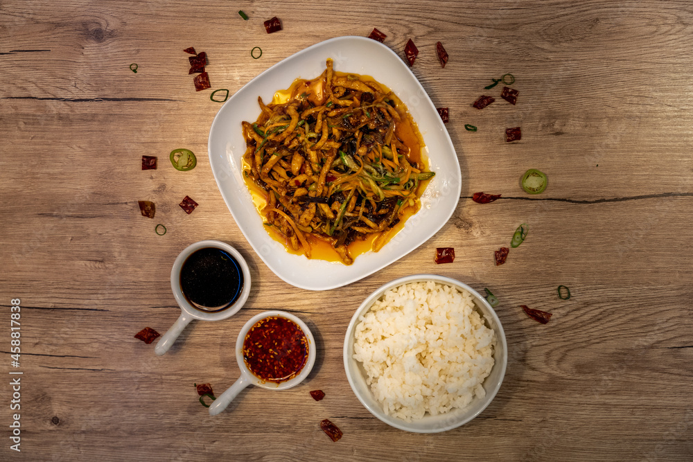 YuXiang chicken, traditional chinese dish served with white rice and soy sauce YuXiang chicken, traditional chinese dish served with white rice and soy sauce