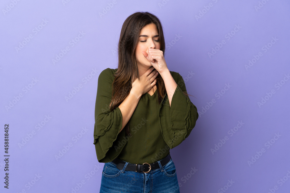 Teenager Brazilian girl over isolated purple background coughing a lot Teenager Brazilian girl over isolated purple background coughing a lot