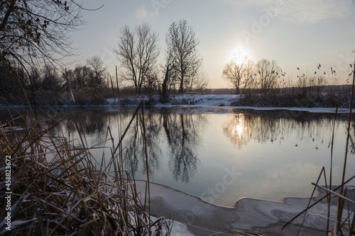 sunset over an unfrozen river