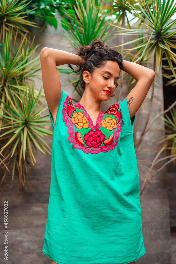 portrait of a beautiful girl wearing traditional Mexican clothing portrait of a beautiful girl wearing traditional Mexican clothing