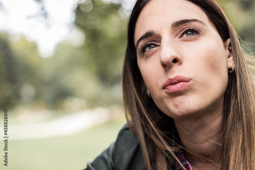 Portrait of a thoughtful woman in autumn nature park Portrait of a thoughtful woman in autumn nature park