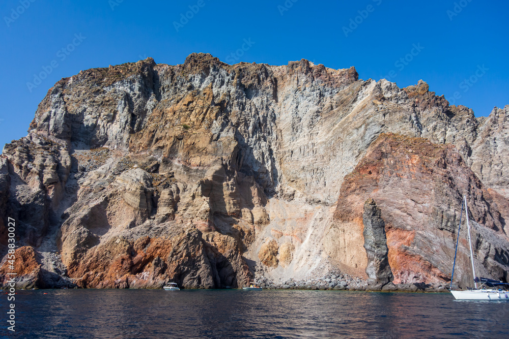 Lipari island (Aeolian archipelago), Messina, Sicily, Italy: view of the seacoast with red rocks.