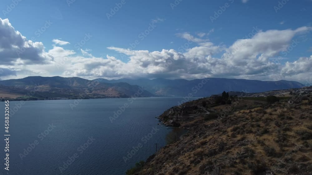 Video from drone lowering down toward shores of Lake Chelan, Washington on a beautiful fall day. Video from drone lowering down toward shores of Lake Chelan, Washington on a beautiful fall day.