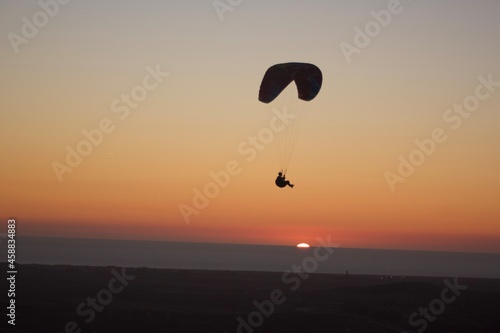 Parachute flight in the sunset