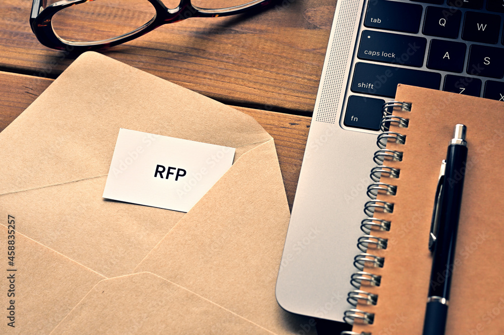 There is a laptop, a pen, an envelope, and a card with RFP which is an  abbreviation for Request For Information written on it. Stock Photo | Adobe  Stock