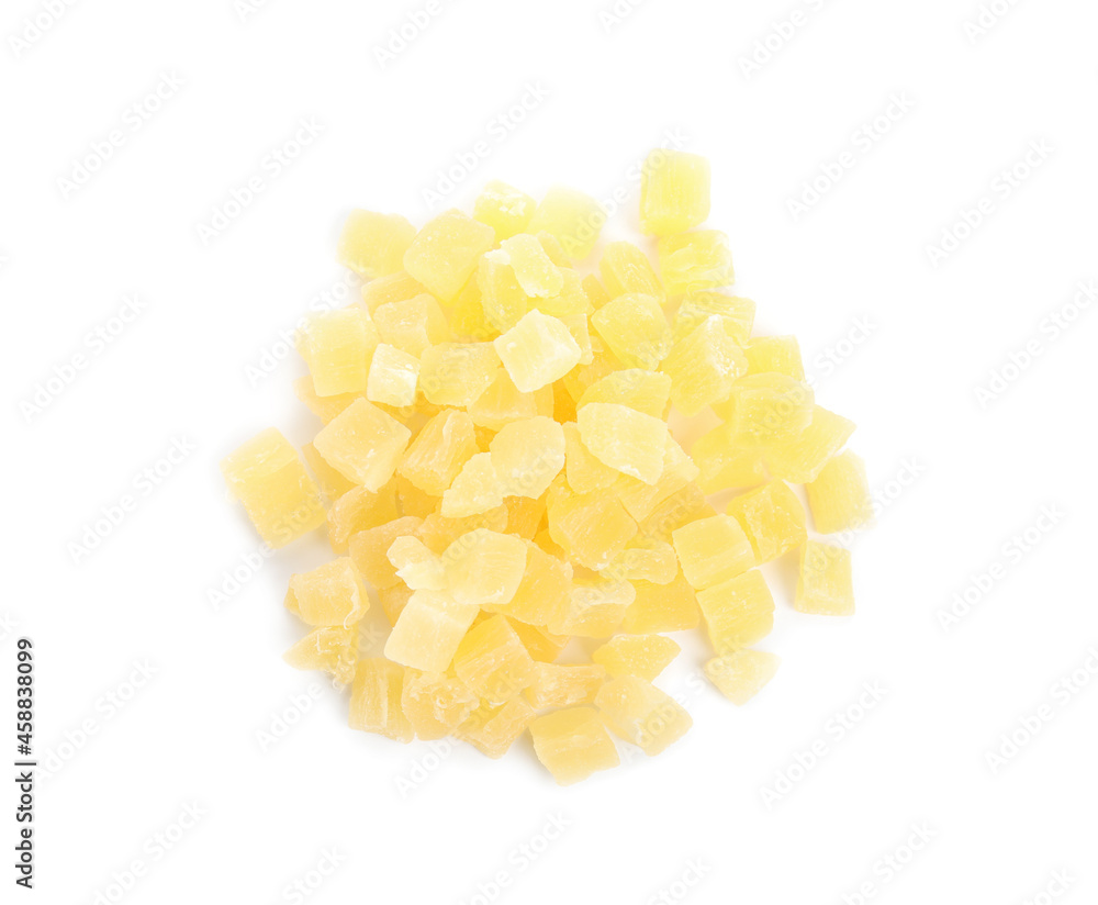 Delicious yellow candied fruit pieces on white background, top view Delicious yellow candied fruit pieces on white background, top view