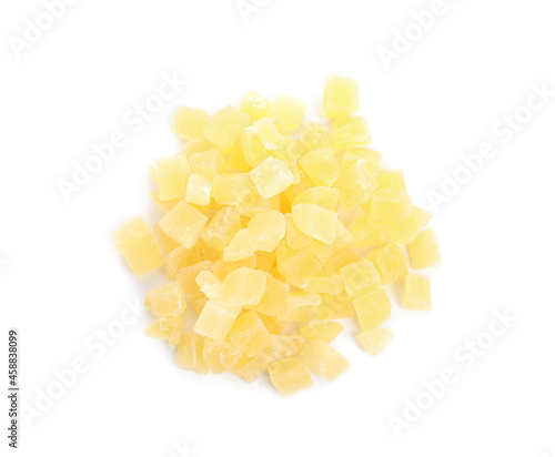 Delicious yellow candied fruit pieces on white background, top view