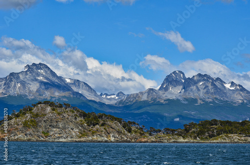 Landscape with Rocky Island and Tierra del Fuego Mountains in Drake Passage of Argentina