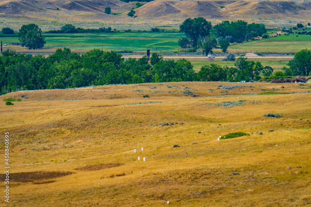 Battle of the Little Bighorn, known also as Wounded Knee, was fought along the  bluffs and ravines of the Little Bighorn River valley, in Montana with white stone representing fallen Calvary soldiers 
