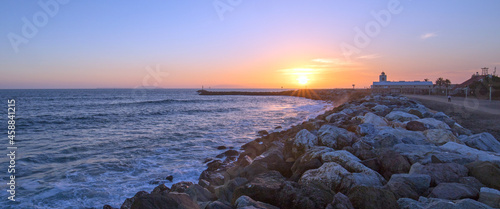 Sunset at Port Hueneme beach jetty rock seawall in Oxnard California United States photo