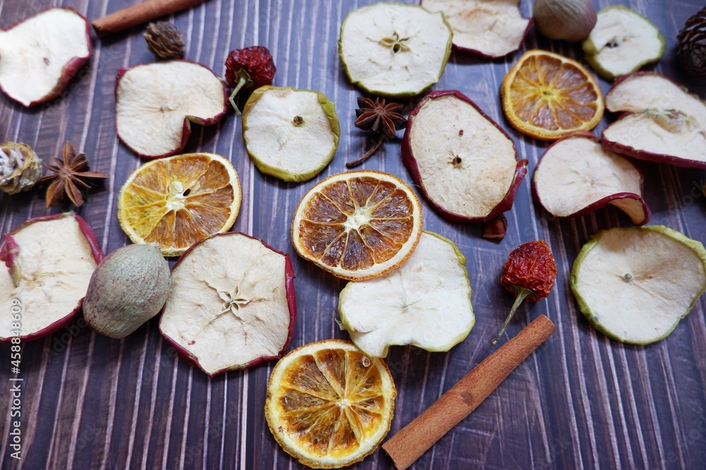 Dried Fruits and spices on dark wooden background. Healthy food, Well being, winter fruits. Dried Fruits and spices on dark wooden background. Healthy food, Well being, winter fruits.