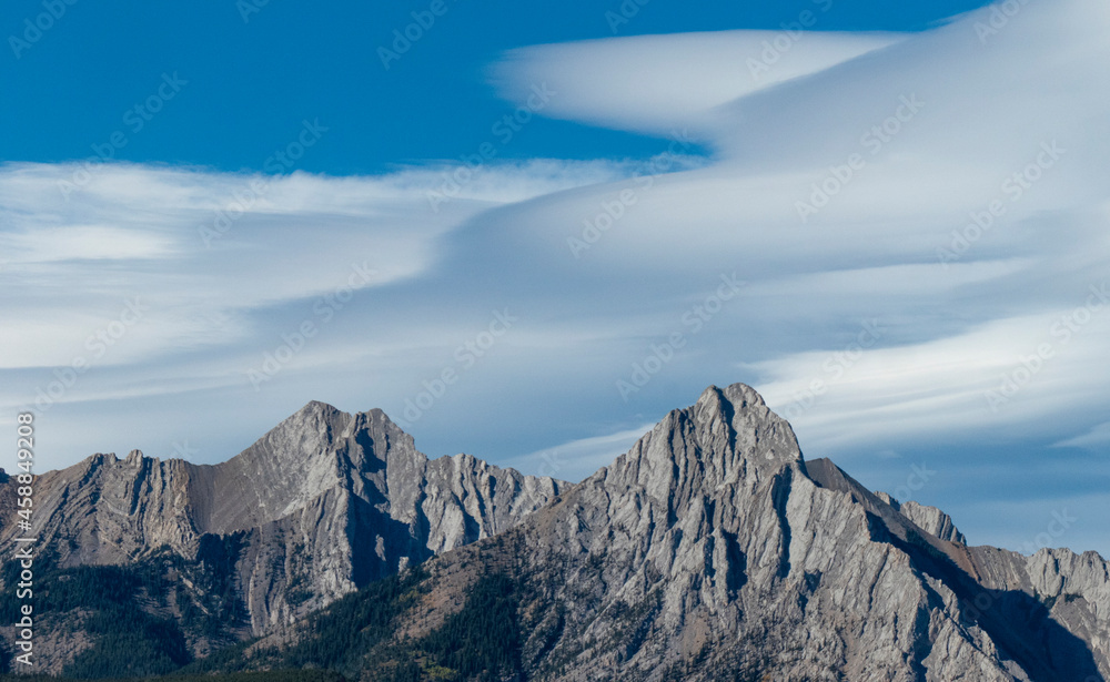 lenticular clouds over the mountains