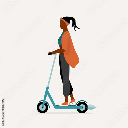 Side View Of A Young Black Woman Traveling With An E-Scooter. Urban And Eco-Friendly Transportation. E-Scooter. Micromobility.