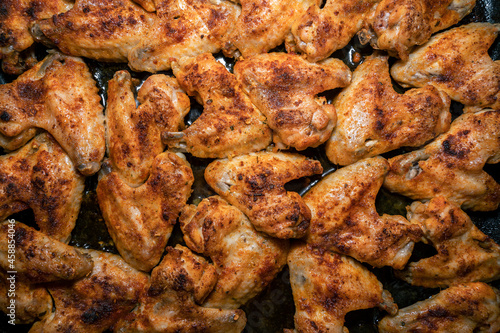 Crispy fried chicken wings on a baking sheet