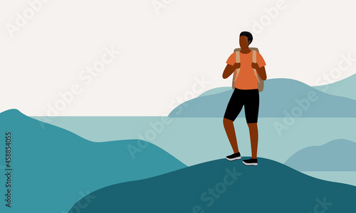 Young Black Man Hiker With Backpack Hiking Alone And Standing On Top The Mountain Peak. Travelling Solo.