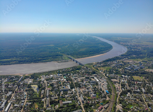 Aerial view of the city, Vyatka river and railway bridge (Kotelnich, Kirov region, Russia)