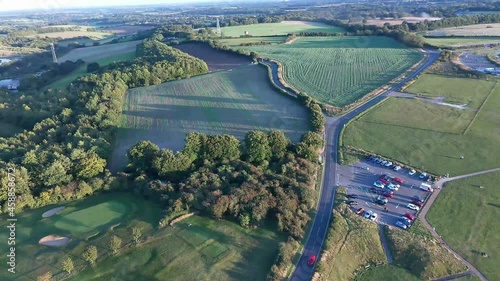 paragliders over a beautiful landscape and hill, drone footage