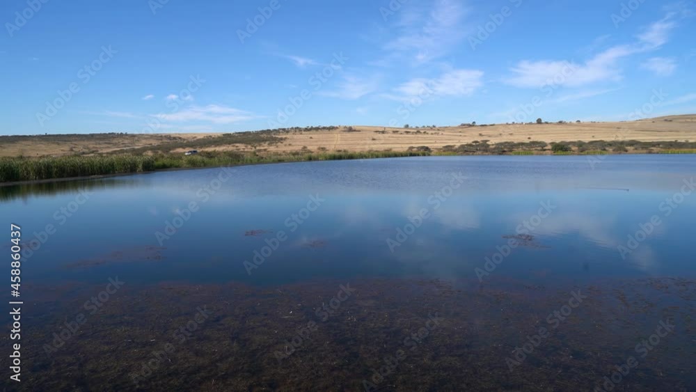 Beautiful blue lake with the clear blue sky above. Beautiful blue lake with the clear blue sky above.