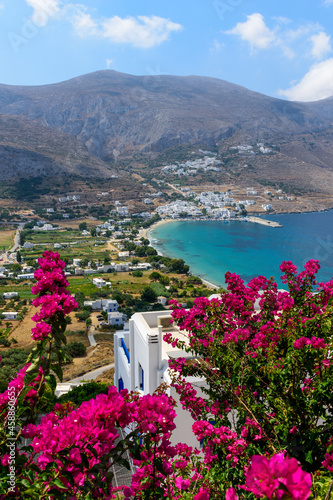 Panorama view of Aegiali and Lagada village framed with bougainvillea flowers , in Amorgos island Greece