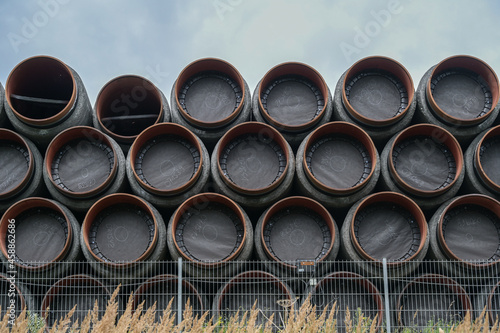 Stacked pipes for the north stream 2 gas pipeline from Russia through the Baltic Sea to Germany at the port of Sassnitz on Rugen in Mecklenburg-Vorpommern, copy space © Maren Winter