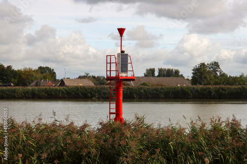 Red water light mark for shipping route at the Hollandsche IJssel photo