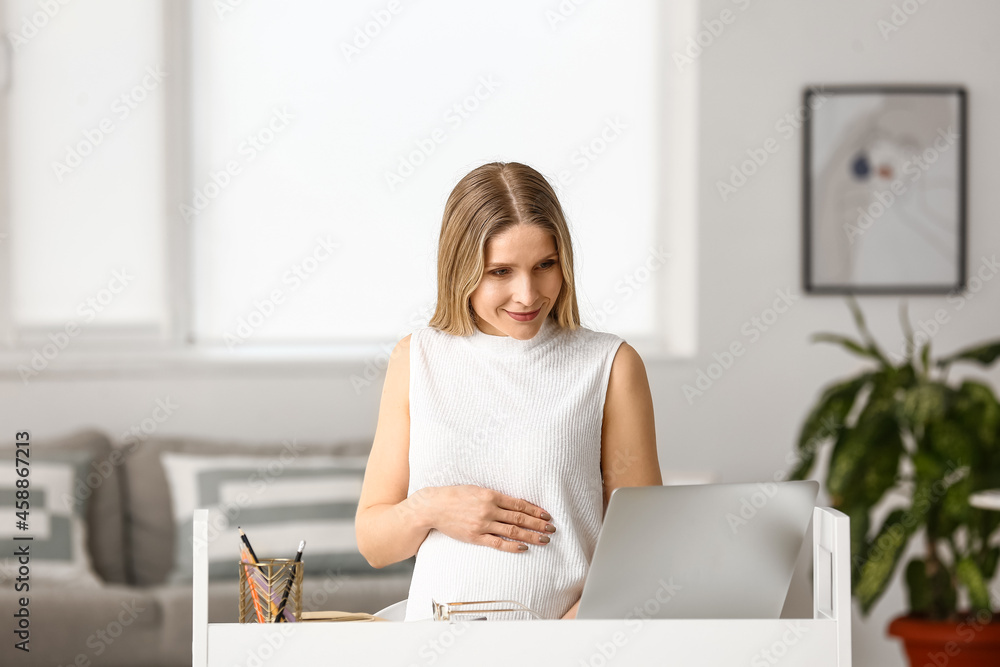 Pregnant businesswoman working at home Pregnant businesswoman working at home