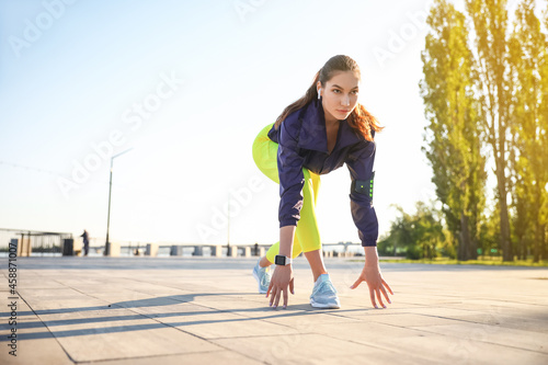 Sporty young woman running ...