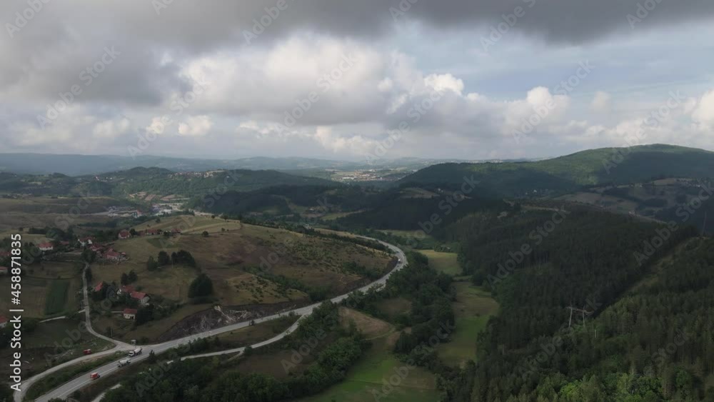 Aerial View of Road Traffic Under Zlatibor Mountain, Serbia on Cloudy Summer Day Aerial View of Road Traffic Under Zlatibor Mountain, Serbia on Cloudy Summer Day