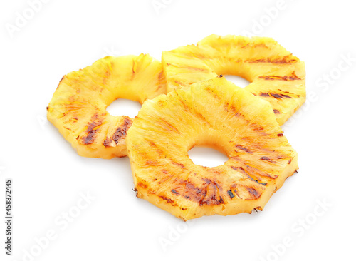 Grilled pineapple slices on white background