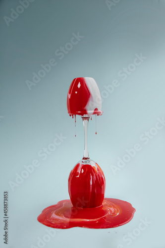 Принти на полотні Laboratory liquid flows down on the glass red and white colors milk and blood co