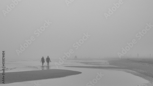 beach with people in fog