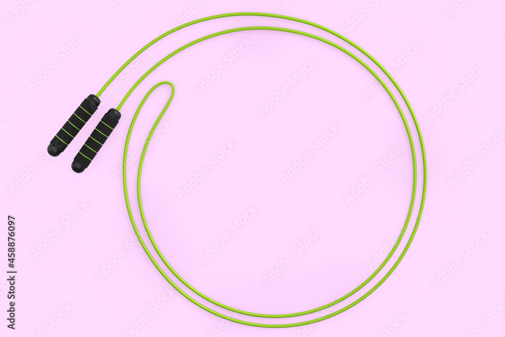 Green skipping rope or jumping rope isolated on pink background.