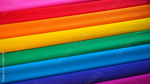 Pride Flag by Gilbert Baker. Symbol of the overall LGBTQ LGBTI community. Crepe paper is available in pink, red, orange, yellow, crepe, blue, purple and magenta. Colorful background for Pride events