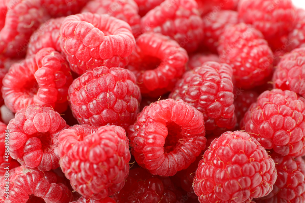 Red juicy raspberries, all over background, close up Red juicy raspberries, all over background, close up