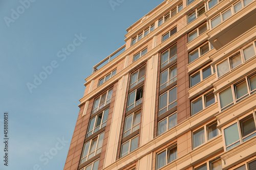 Modern multi - storey building against blue sky