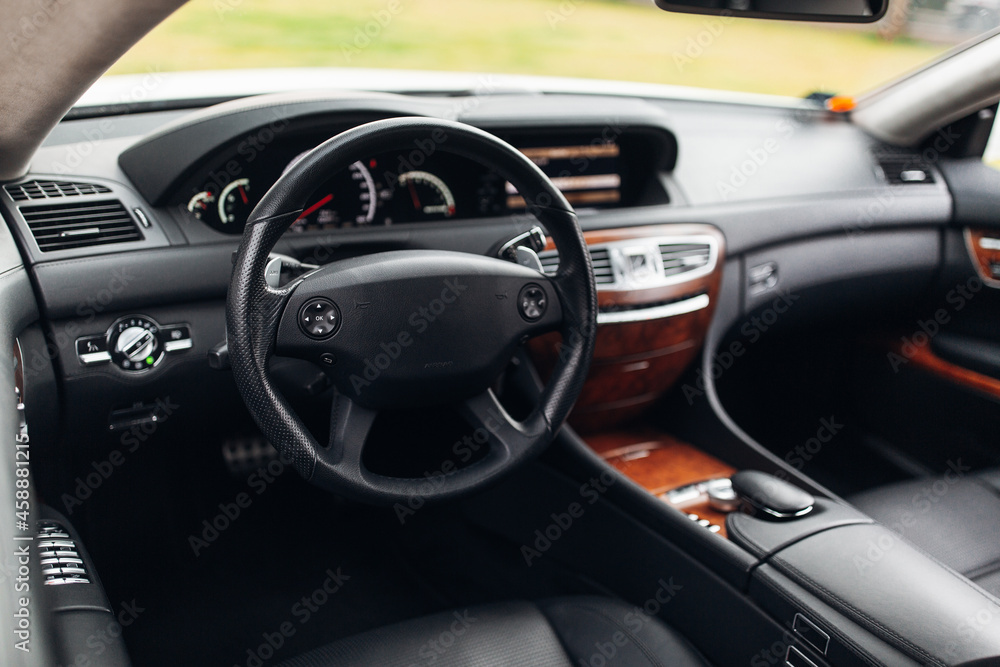 Modern car interior wide view with the leather panel, and dashboard