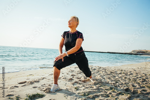 Elderly woman doing some morning exercise and stretching