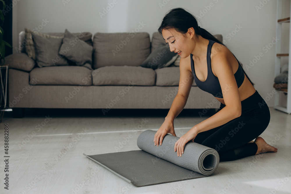 Fototapeta premium Woman with yoga mat at home