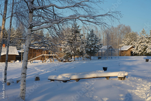 winter landscape with snow, sun, blue sky and snowy trees © Марина Верина