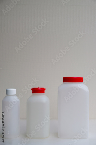 Set of plastic bottles for water analysis in France. Drinking water analysis. Copy space. Vertical image. 
