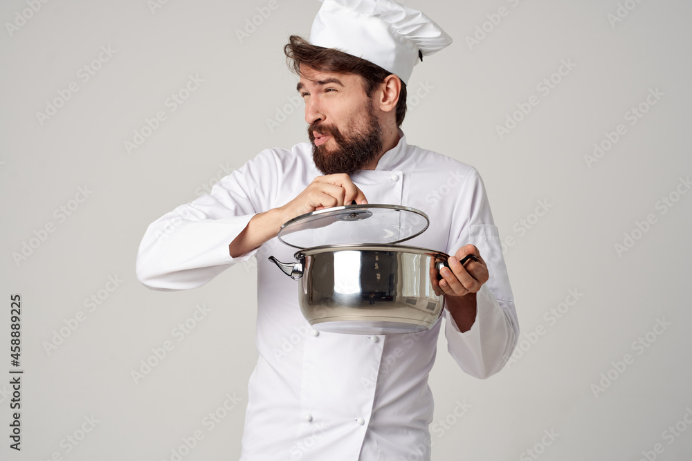 emotional male chef with a saucepan in his hands cooking restaurant industry