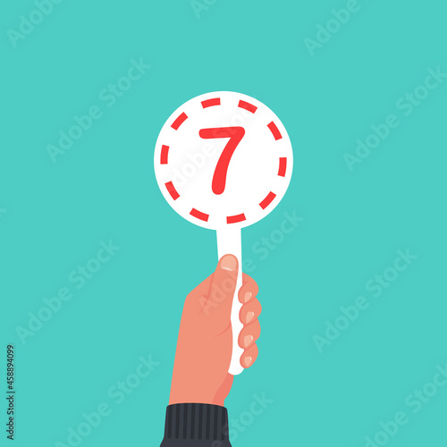 Score card 7. Number table. Digit rating on a scorecard. Human hand holding score card. Colored scorecards. Juries assessment on competition. Judges hold score. Vector design. Isolated on background.