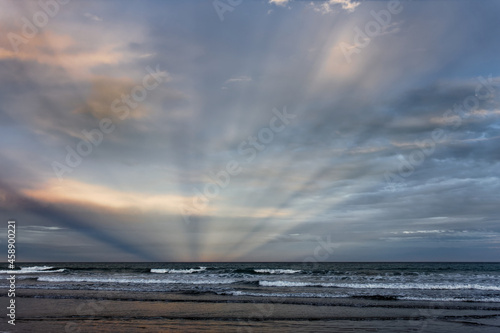 Sunbeams at Woodend Beach, south island, New Zealand. photo
