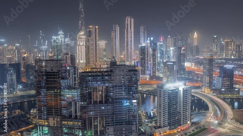 Wallpaper Mural Panoramic skyline of Dubai with business bay and downtown district night timelapse. Torontodigital.ca