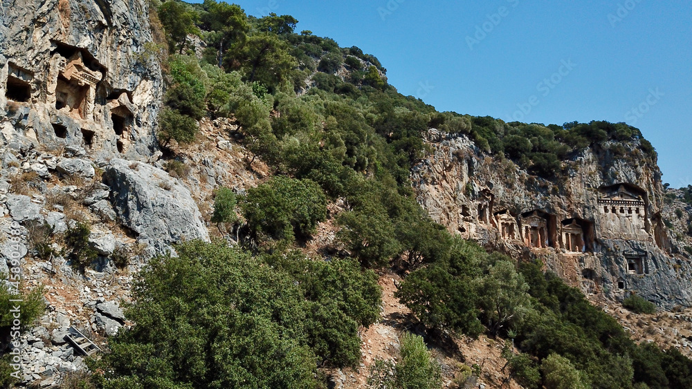 King rock tombs in the ancient city of Kaunos. Dalyan near Iztuzu beach, which is the spawning area of Caretta Caretta. Caunos and Lycian ancient city. King rock tombs in the ancient city of Kaunos. Dalyan near Iztuzu beach, which is the spawning area of Caretta Caretta. Caunos and Lycian ancient city.
