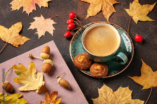 Autumn background with cup of black coffee and fall decoration © ffphoto